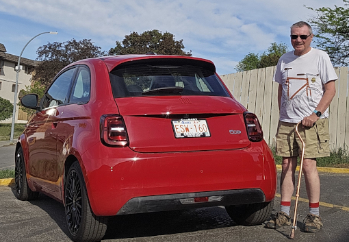 Small clean red car at motel